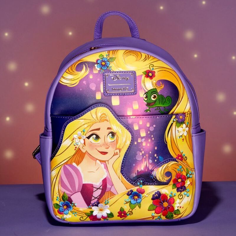 Purple mini backpack featuring Rapunzel on the front watching the lanterns with Pascal, with a light purple/pink background with spots of light.